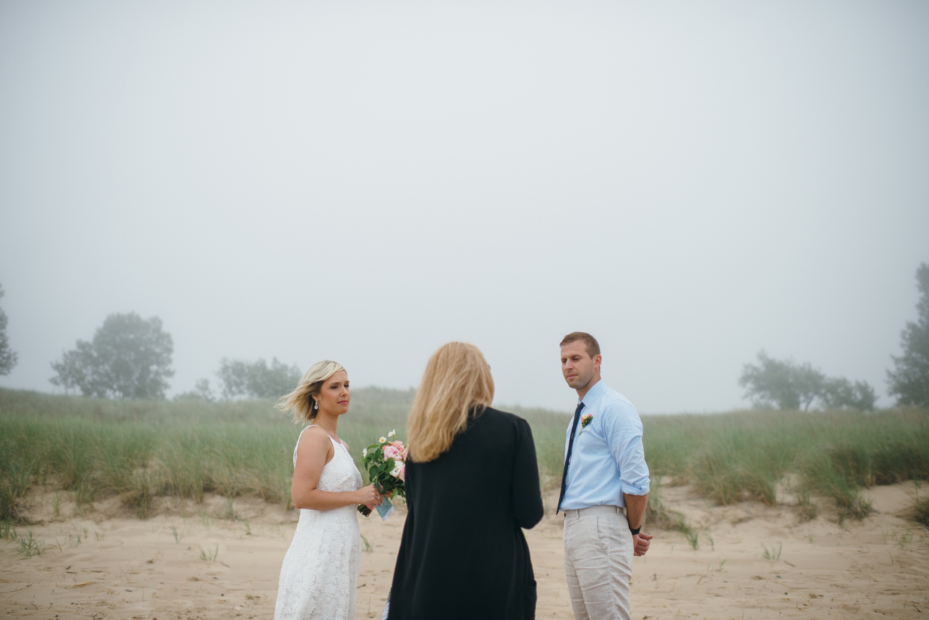 couple eloping in michigan on the beach