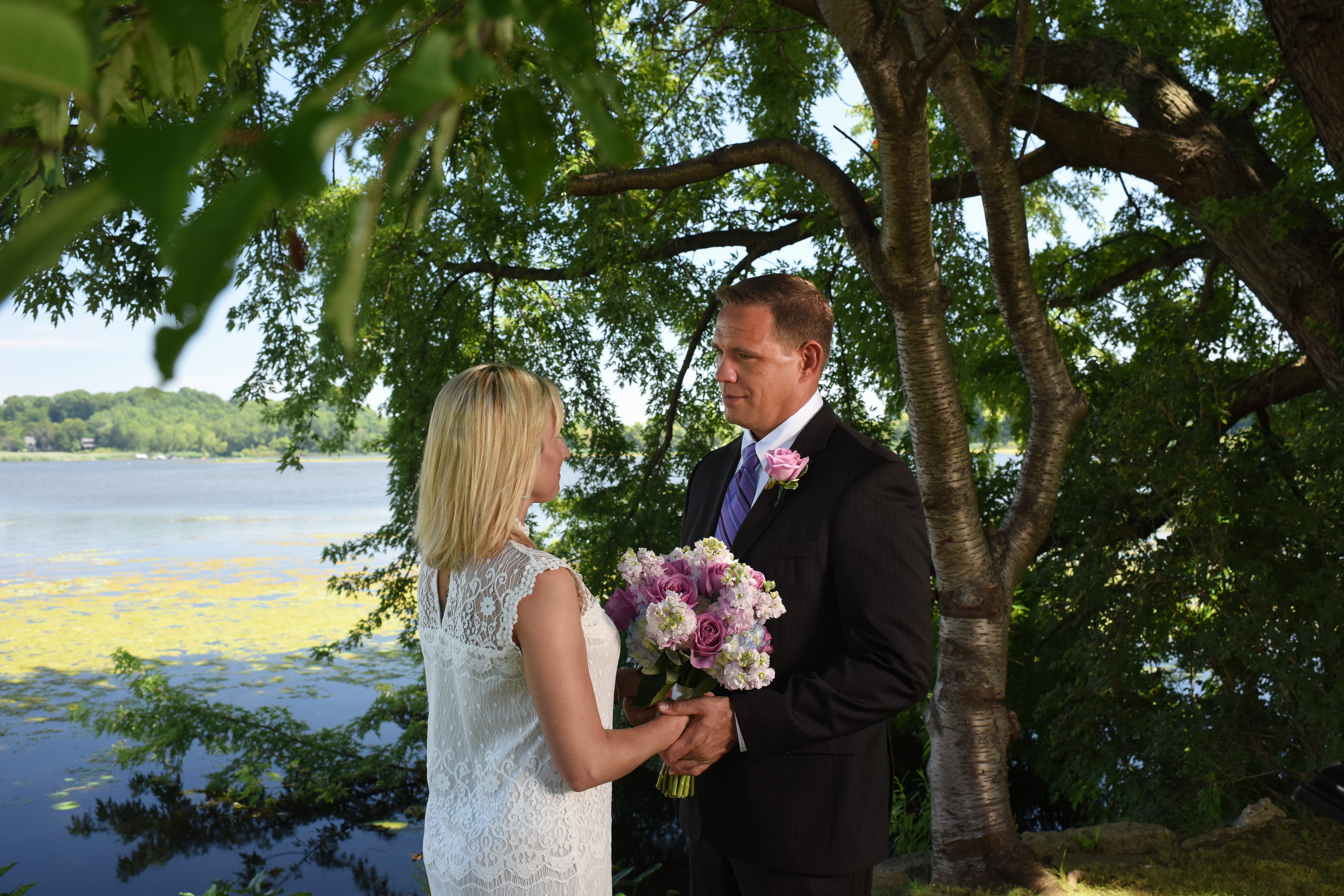 couple exchanging looks during elopement at wade's bayou
