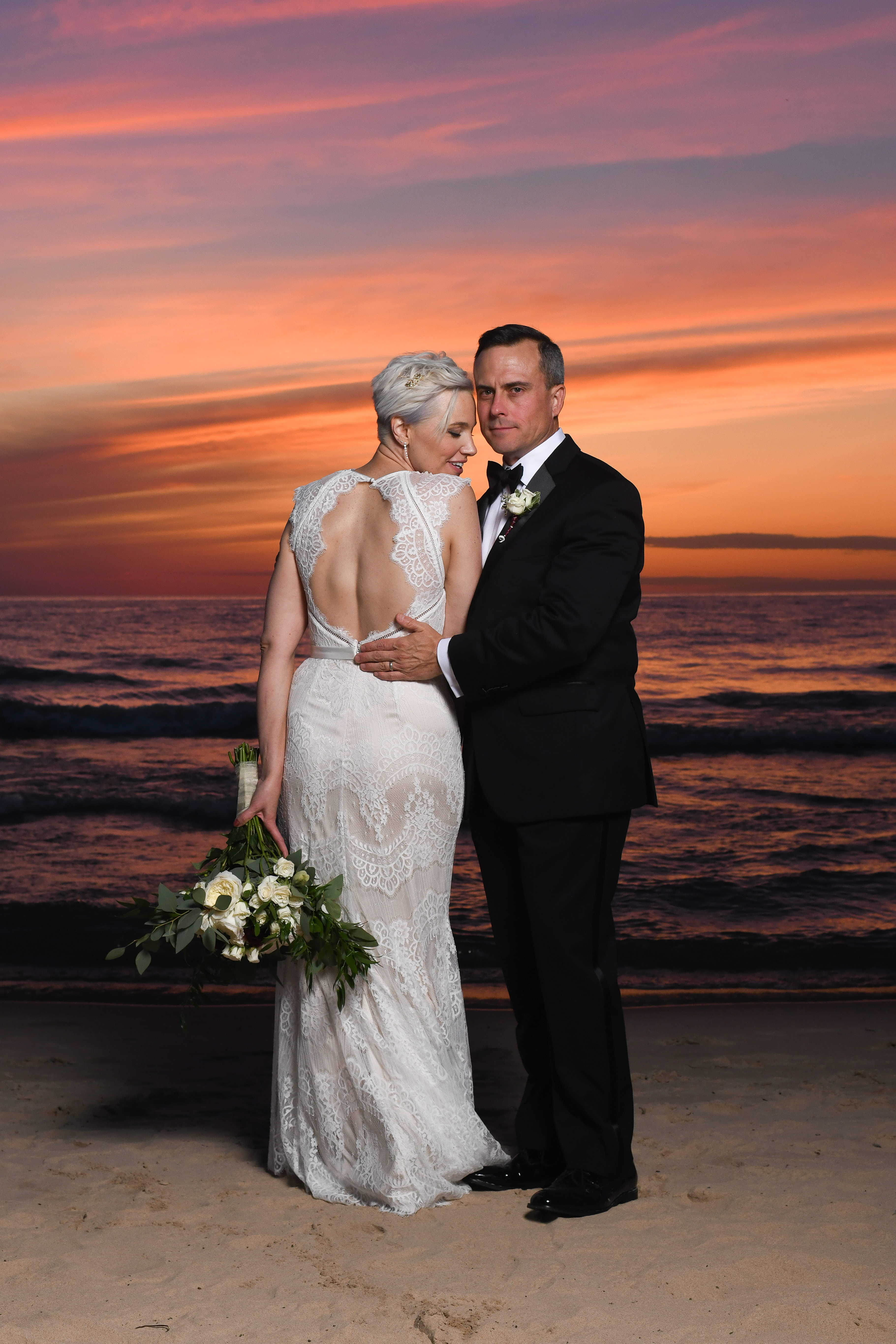 sumer elopement, elope in South Haven on the beach, bride and groom on beach at sunset