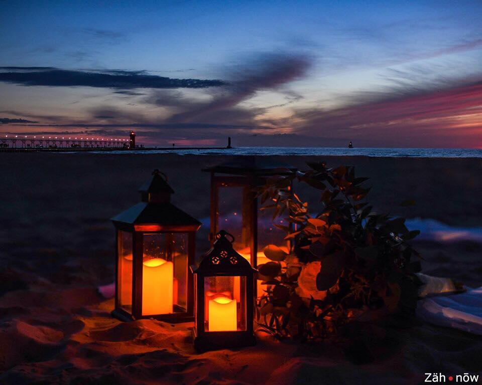 lanterns on a beach at sunset add on option